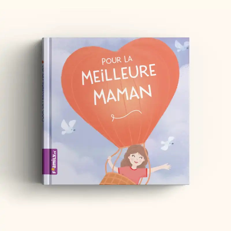Le livre « Pour la meilleure maman » de Framily montre une maman souriante dans une montgolfière rouge en forme de cœur, volant parmi les nuages et les oiseaux blancs, avec le texte : Pour la meilleure maman – un cadeau inoubliable pour maman.